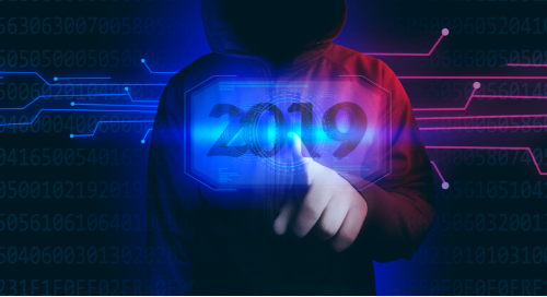 Hacker pointing at 2019 on a computer screen