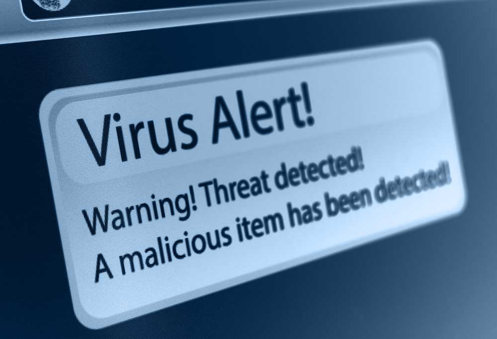 "Virus Alert" pop up on a laptop. 
