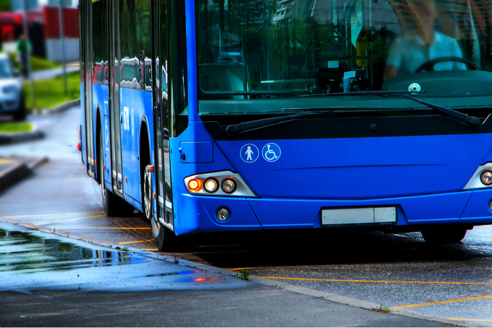 The transportation industry isn't immune from the sights of hackers. A large blue city bus waits to pick up passengers. 