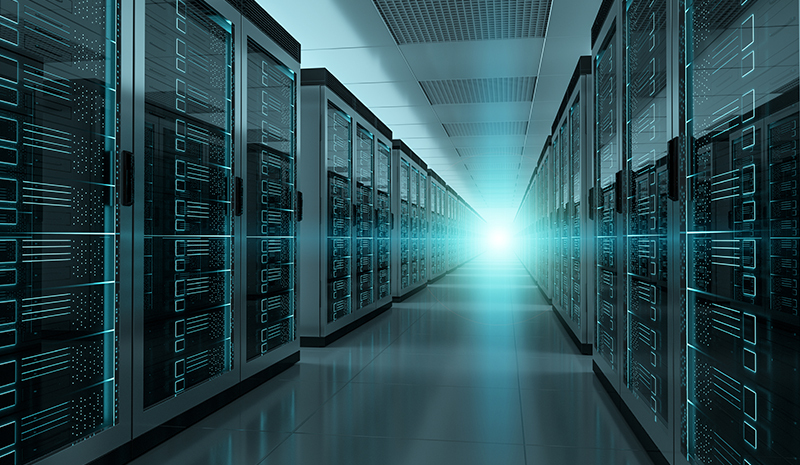 Inside of a data server room. See lines of computer servers. 