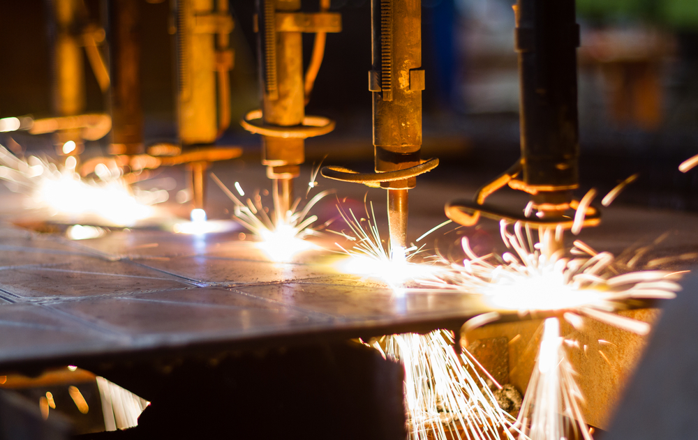 Sparks from a machine inside of a manufacturing assembly line. 