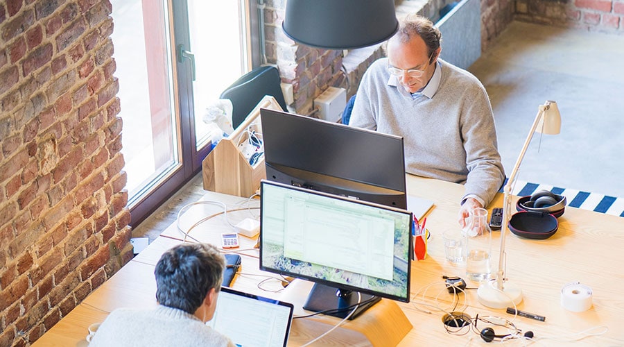 Two startup employees working within an office