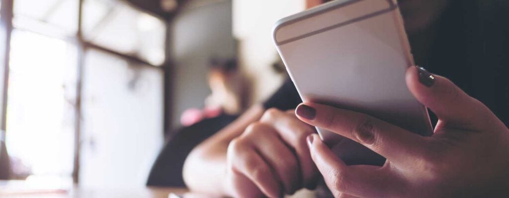 Closeup of a woman holding a cell phone