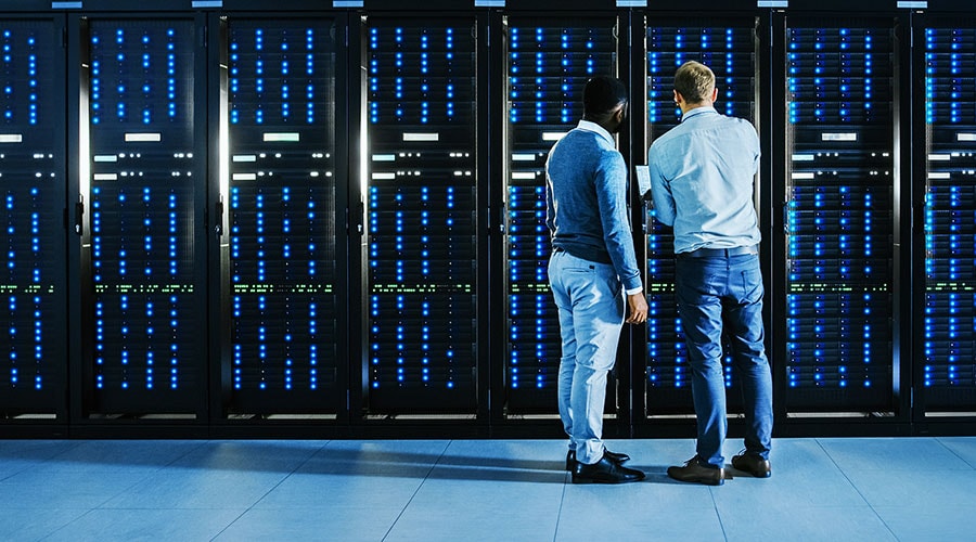 Two technicians in a data center