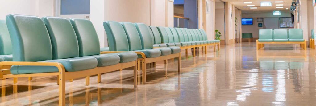 Inside of an empty hospital waiting room. 